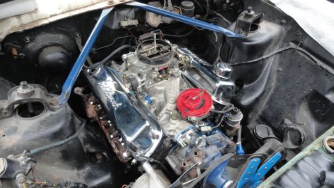 1964 Ford Fairlane - Engine bay view showing chrome Edelbrock valve covers and a red air cleaner assembly.