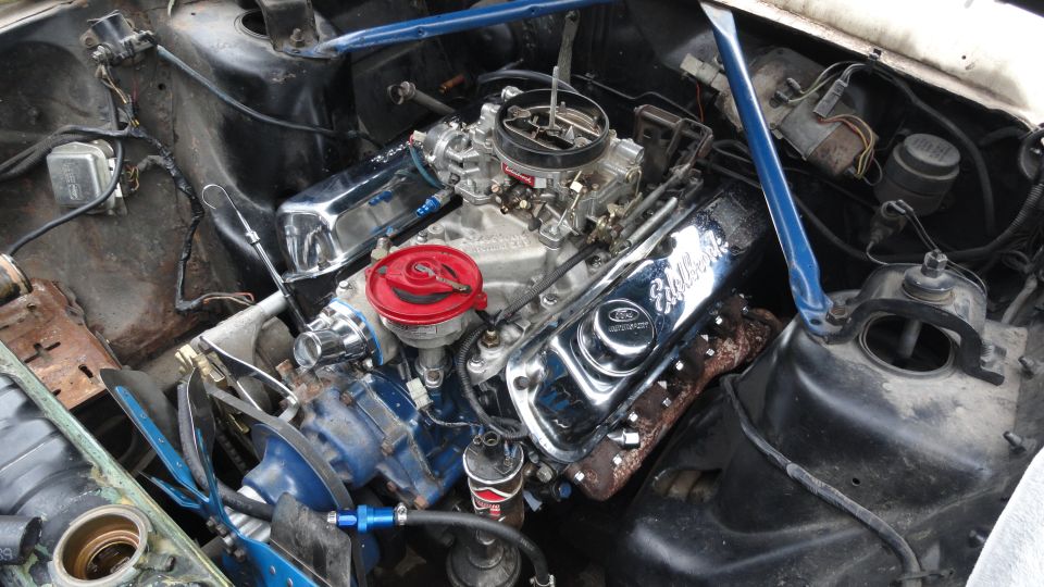 Ford small-block V8 with Edelbrock intake, four-barrel carb and chrome valve covers