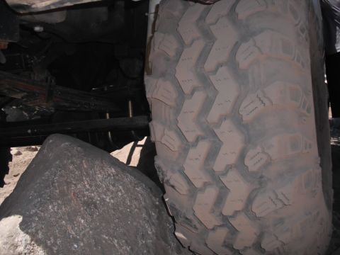 1991 Ford Bronco - This image shows a close-up of an off-road tire and suspension components, not a specific vehicle model.