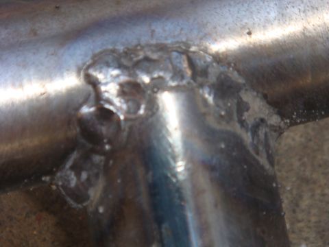 1992 Ford Bronco - This image shows a close-up of a weld on metal tubing, with a Supermotors.net logo in the corner.