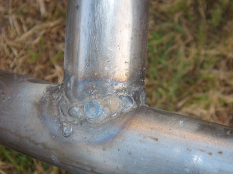 1992 Ford Bronco - Close-up view of welded metal tubing, showing the weld joints and surface texture.