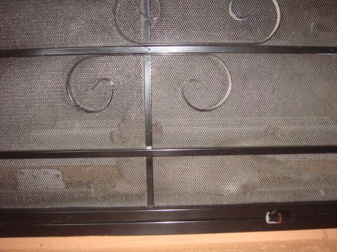1992 Ford Bronco - A close-up view of a decorative metal screen with a Supermotors.net logo visible.