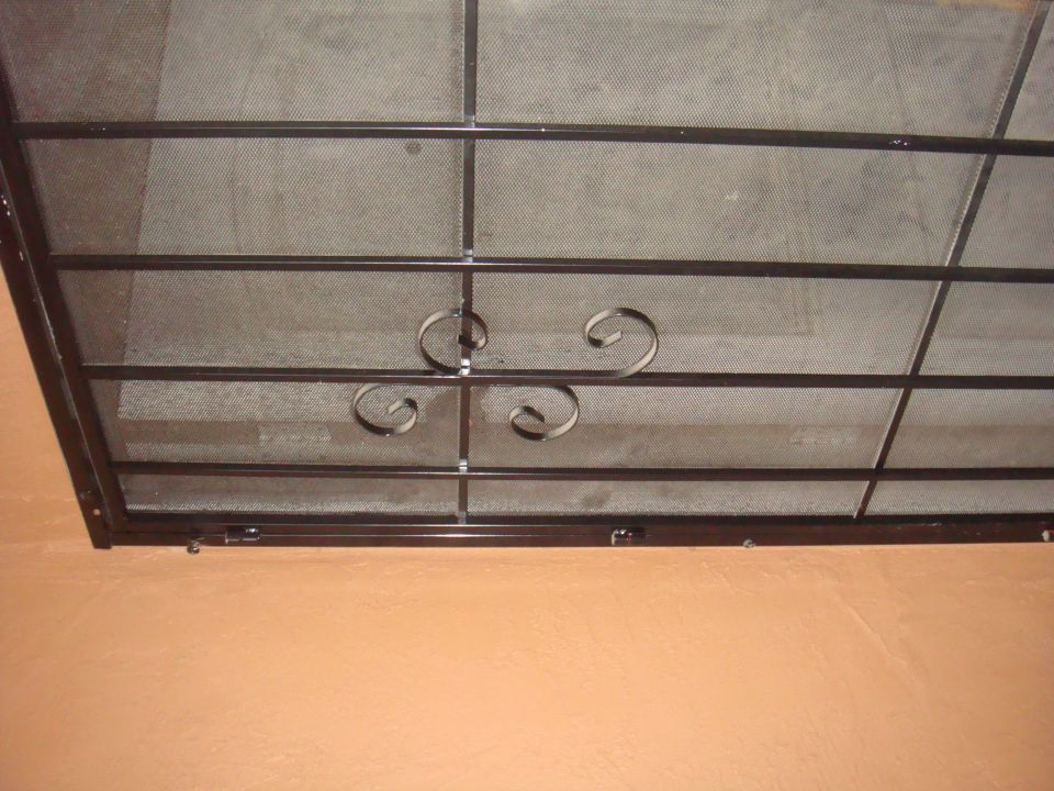 Window security bars with decorative scrollwork