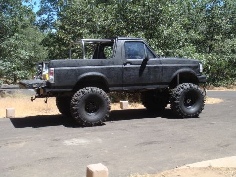 1992 Ford Bronco - This modified 1992 Ford Bronco features a significant lift kit and oversized off-road tires.