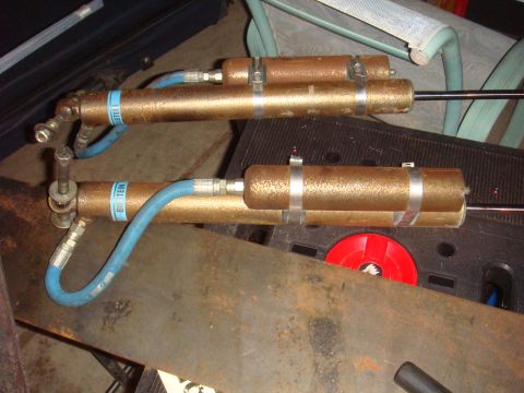 1992 Ford Bronco - Pair of Bilstein shocks with blue hoses, likely for an off-road vehicle.
