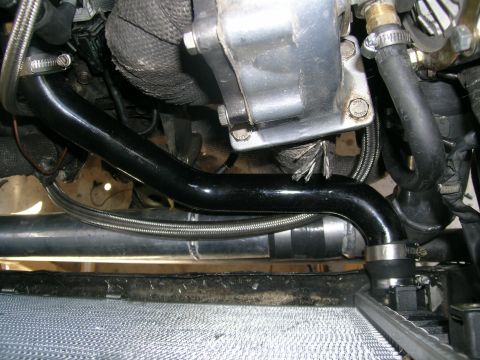 1995 Ford Probe - Close-up view of engine bay modifications, including custom piping and turbo components.