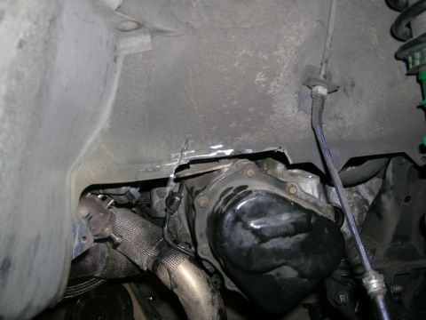 1995 Ford Probe - Close-up of a car's transmission and exhaust system, showing modifications like heat wrap.