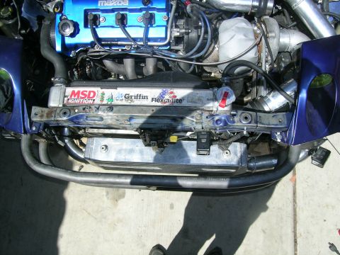 1995 Ford Probe - Customized Mazda engine bay a turbocharger, intercooler, and aftermarket cooling components.