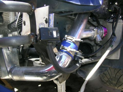 1995 Ford Probe - Close-up of custom turbocharger piping and blow-off valve installation.