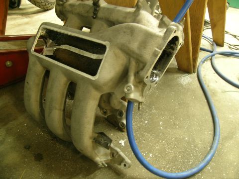 1995 Ford Probe - An intake manifold is shown with a blue hose, likely during a repair or modification.