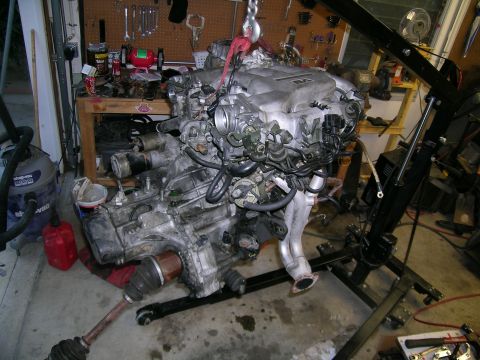 1995 Ford Probe - Engine assembly being hoisted, likely for a turbo build project.