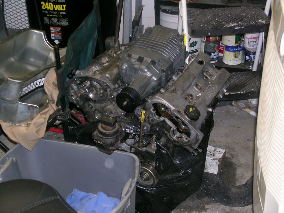 Engine with supercharger, looks like it's been disassembled