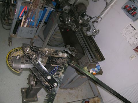1995 Ford Probe - Workshop scene a metal pipe bender and a lathe, likely used for fabrication.