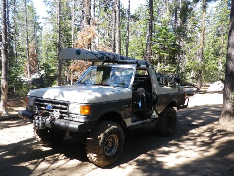 1991 Ford Bronco - This 1991 Ford Bronco is equipped for an outdoor adventure with a canoe secured to its roof rack.
