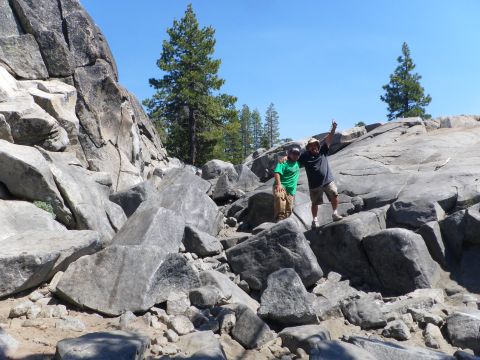 1991 Ford Bronco - Two men pose on a large rock formation in a natural outdoor setting.