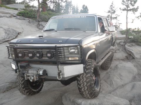 1991 Ford Bronco - This Ford Bronco is equipped for off-road adventures, navigating a rocky terrain.