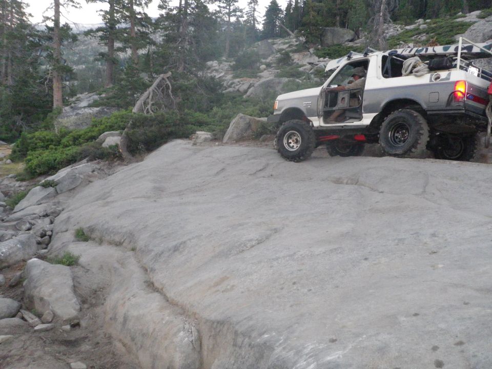 1991 Ford Bronco climbing a rocky trail
