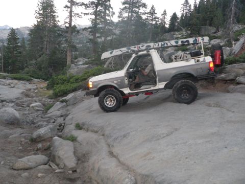 1991 Ford Bronco - This 1991 Ford Bronco navigates a rocky trail with a canoe secured to its roof rack.