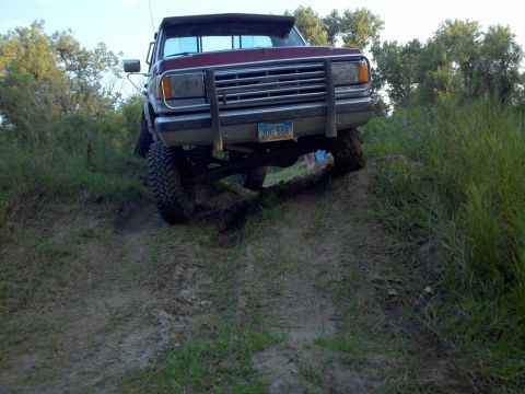 1988 Ford F-150 - This 1988 Ford F-150 is navigating a steep, muddy incline.