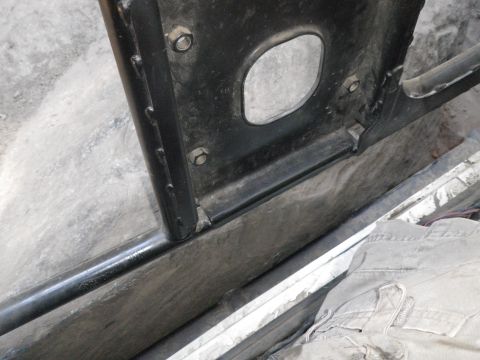 1991 Ford Bronco - Detail shot of a vehicle's interior door frame and rocker panel, showing construction and wear.