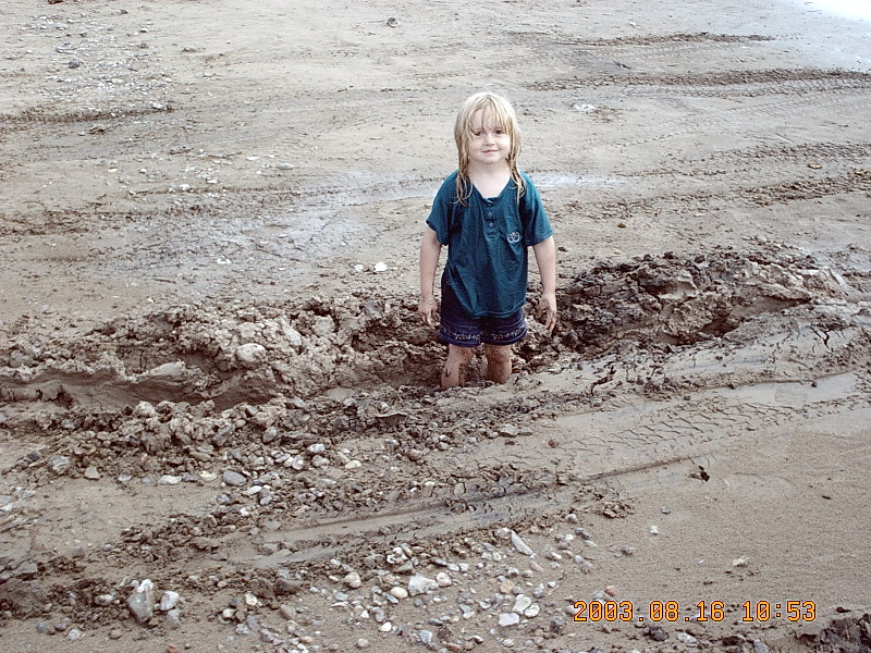 my daughter standing in the whole notice the transfer case skid plate hit.