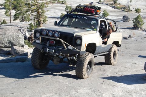 1993 Jeep Wrangler - This modified truck is equipped for off-road adventures with its heavy-duty bumper and lights.