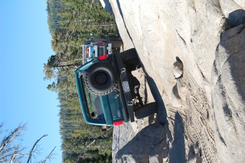 1993 Jeep Wrangler - This 1993 Jeep Wrangler navigates a challenging rock obstacle, its off-road capabilities.