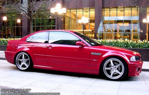 1998 Ford Crown Victoria - Red BMW M3 coupe with aftermarket wheels parked in front of a modern building.