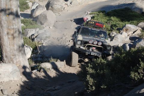 1993 Jeep Wrangler - A modified Jeep CJ-7 navigates a challenging, dusty, off-road course.