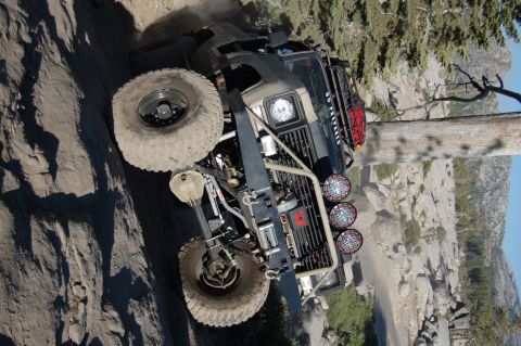 1993 Jeep Wrangler - This 1993 Jeep Wrangler navigates a challenging rocky incline, demonstrating its off-road capabilities.