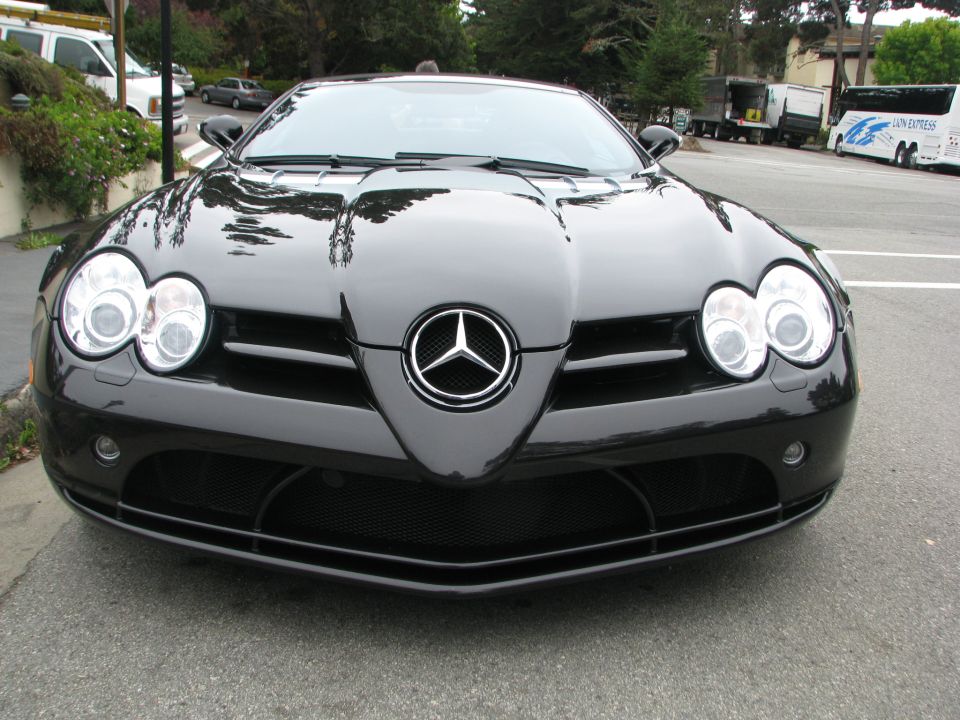 Black Mercedes-Benz SLR McLaren front view. Has a Mercedes-Benz logo on the grille