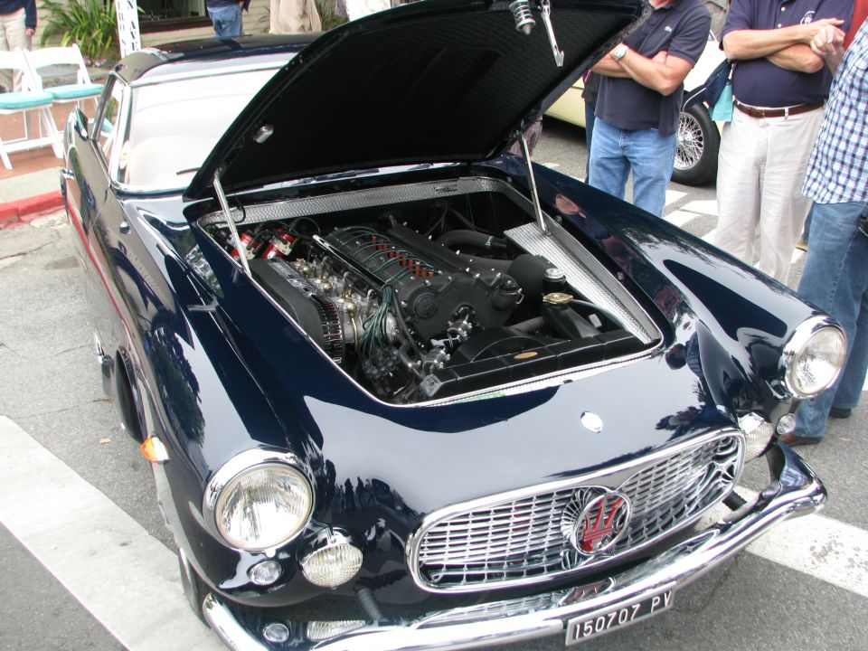 Dark blue coupe engine bay with V8 engine visible