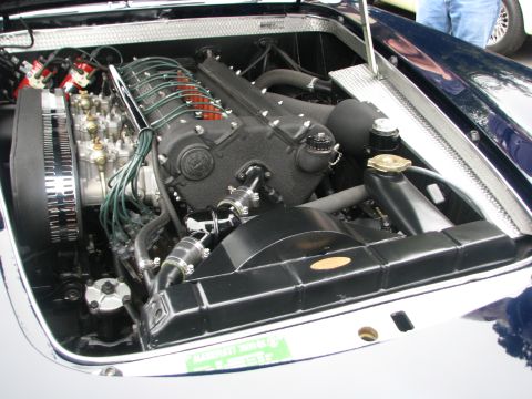 2004 Chrysler PT Cruiser - Close-up of a V12 engine in a car's engine bay, intricate wiring and fuel systems.