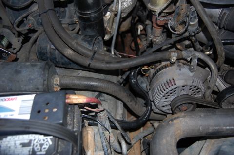 1994 Ford Bronco - Charge cable installed. The stock exciter wire runs in the small wire loom taped to the charge cable.