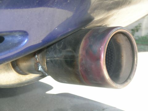 1995 Ford Probe - Custom exhaust pipe tip shows signs of heat discoloration from use.