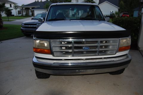 1994 Ford Bronco - Grill reinstalled. Cooler visible.