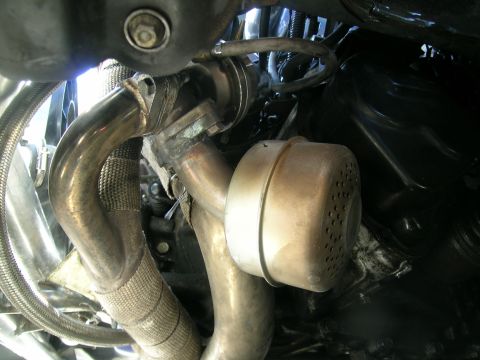 1995 Ford Probe - Close-up view of a turbocharger and exhaust system components.