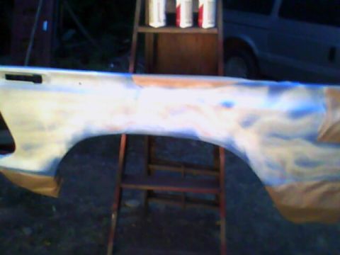 1978 Ford Bronco - Fender being prepped for paint, with a ladder and cans in the background.