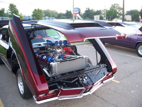 1971 Ford Ranchero - This heavily modified 1971 Ford Ranchero features a custom engine and butterfly doors, revealing its powerful internals.