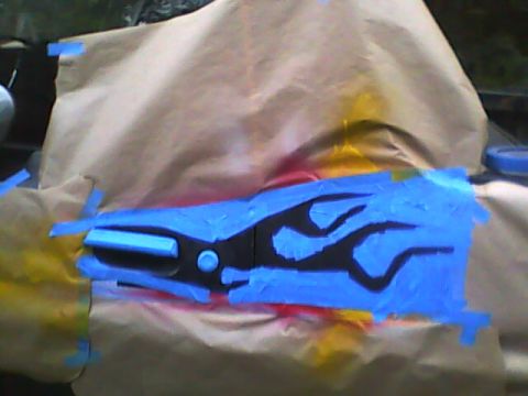 1978 Ford Bronco - A black panel masked off with brown paper and blue tape, with the flame shapes fully masked so only the flame outlines remain exposed for p…