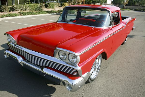 1959 Ford Ranchero pickup truck, red exterior, chrome grille, and custom wheels