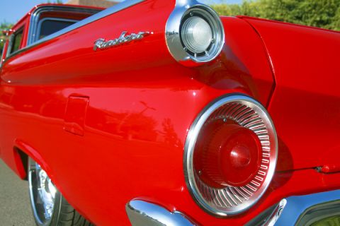 1959 Ford Ranchero - Close-up of the rear of a red 1959 Ford Ranchero, showing its distinctive taillight and chrome accents.