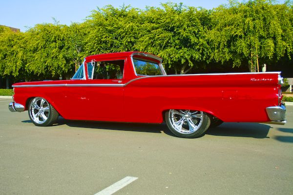 Red Ford Ranchero coupe utility in side profile on polished billet wheels