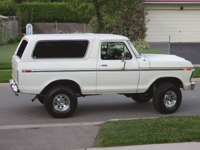 White 1978 Ford Bronco parked on a suburban street, side view
