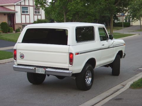 1978 Ford Bronco - Rear view of a white 1978 Ford Bronco parked on a residential street.