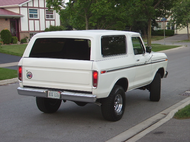 1978 Ford Bronco rear view, parked on street with house in background