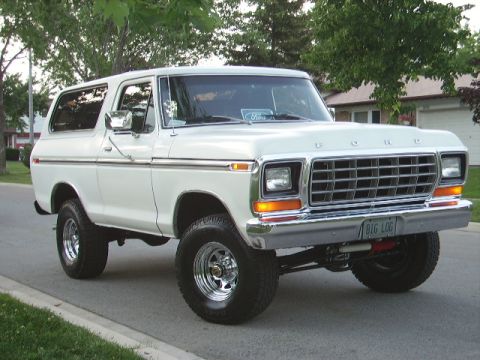 1978 Ford Bronco - This 1978 Ford Bronco features a chrome grille and a custom license plate reading 'BIG LOG'.