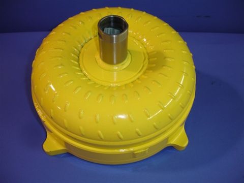 1990 Ford Bronco - Yellow torque converter, likely for an automatic transmission, shown against a blue backdrop.