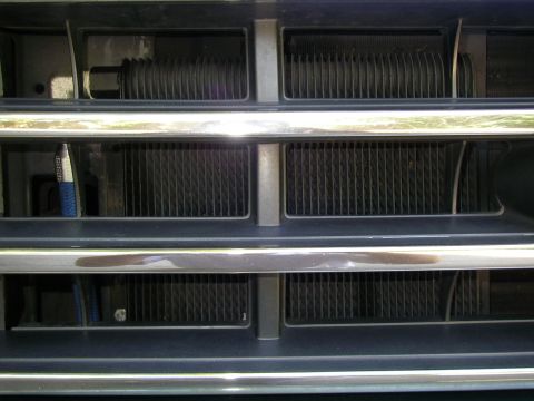 1990 Ford Bronco - Close-up of the 1990 Ford Bronco's front grille, showing its distinctive horizontal bars.