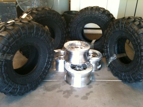 1966 Ford Bronco - Off-road tires and polished aluminum wheels are displayed together.